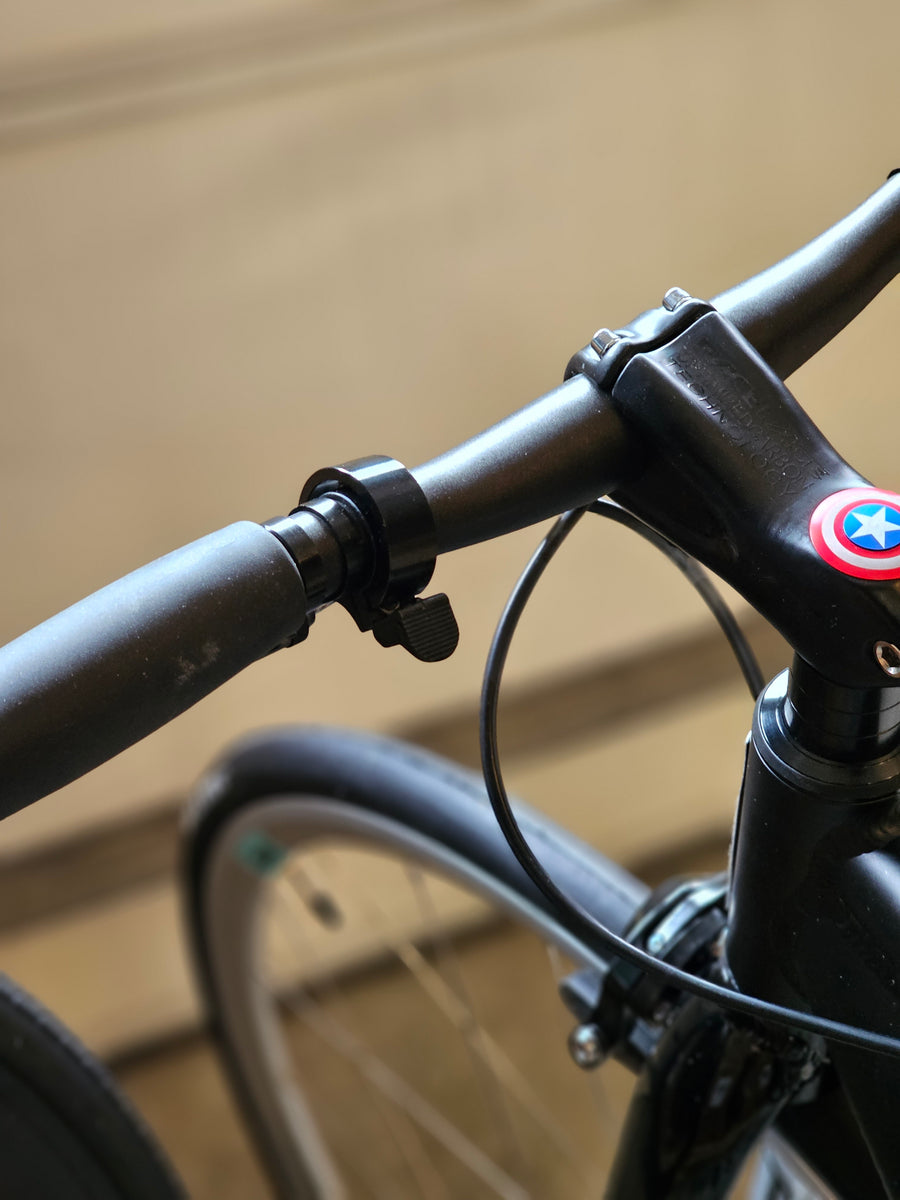 Low profile store bike bell