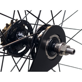 Fixed cog lockring tool in use on rear wheel hub of track bike.
