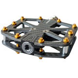 Dual-sided carbon fiber bike pedals with titanium spindle and gold removable spikes