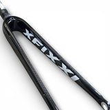 Side detail of XFIXXI full carbon fibre front fork in gloss black with logo