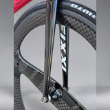 Front fork and wheel close-up of XFIXXI Première V3 Carbon Limited Edition bike