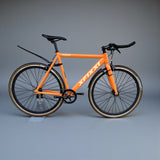 Full view of orange bike with XFIXXI quick-release front and rear mud guards