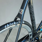 Close-up view of XFIXXI VÉLO VITE Low Pro Track Bike seat cluster and top tube in blue and black